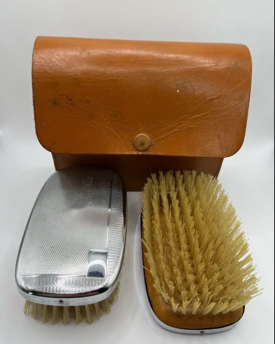 Vintage grooming brushes in hide case - Image 1
