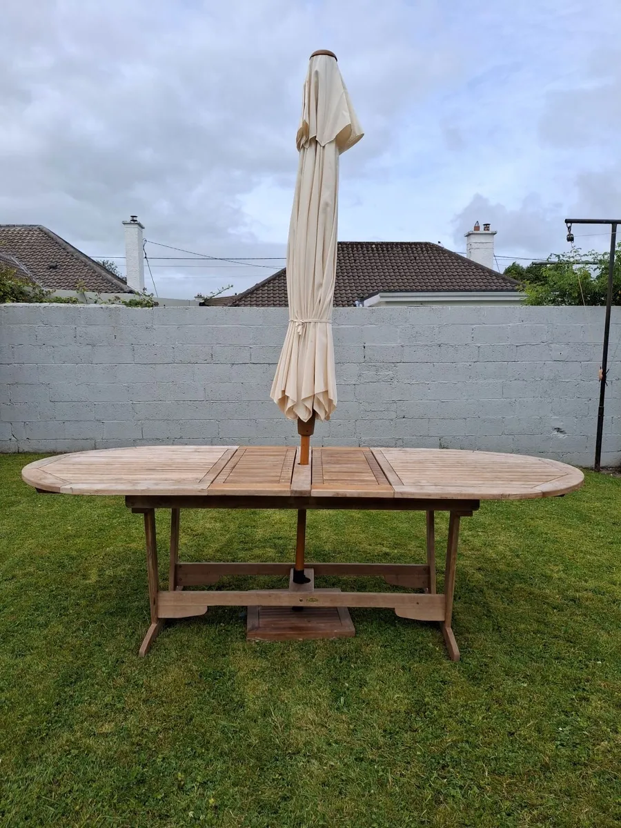 Outdoor table and chairs with parasol. - Image 2