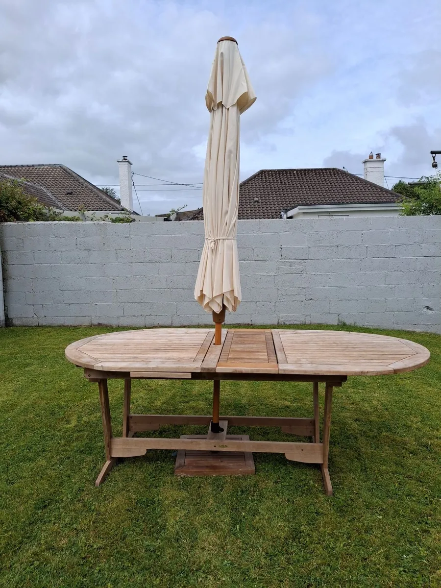 Outdoor table and chairs with parasol. - Image 3