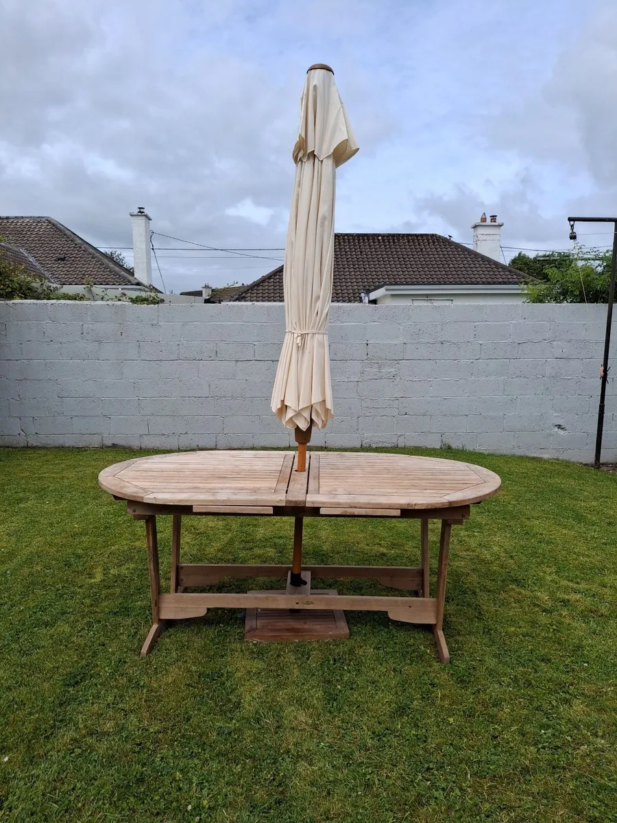Outdoor table and chairs with parasol. - Image 4