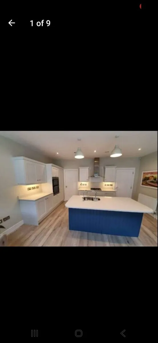 Kitchen with Granite Island and cooker hood - Image 1