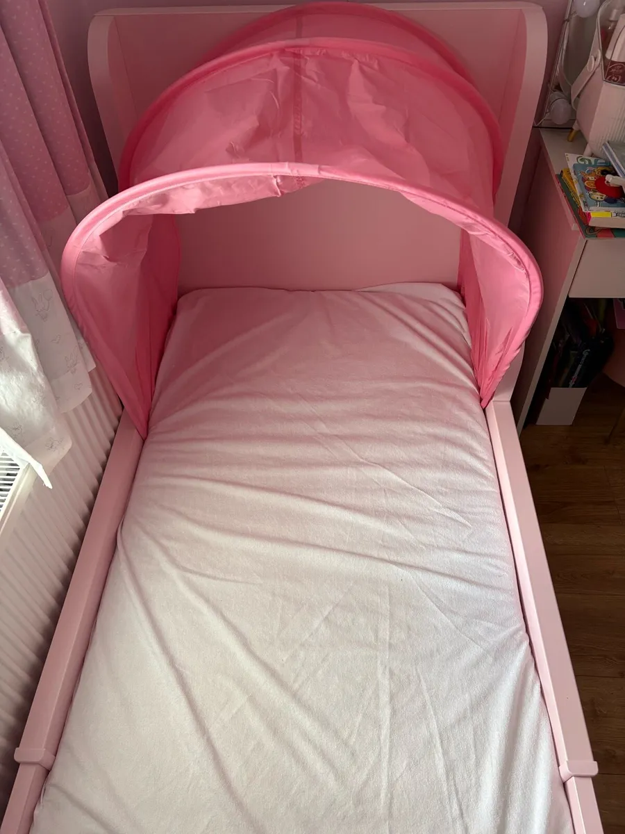 Pink Ikea children’s extendable bed (BUSUNGE) - Image 1