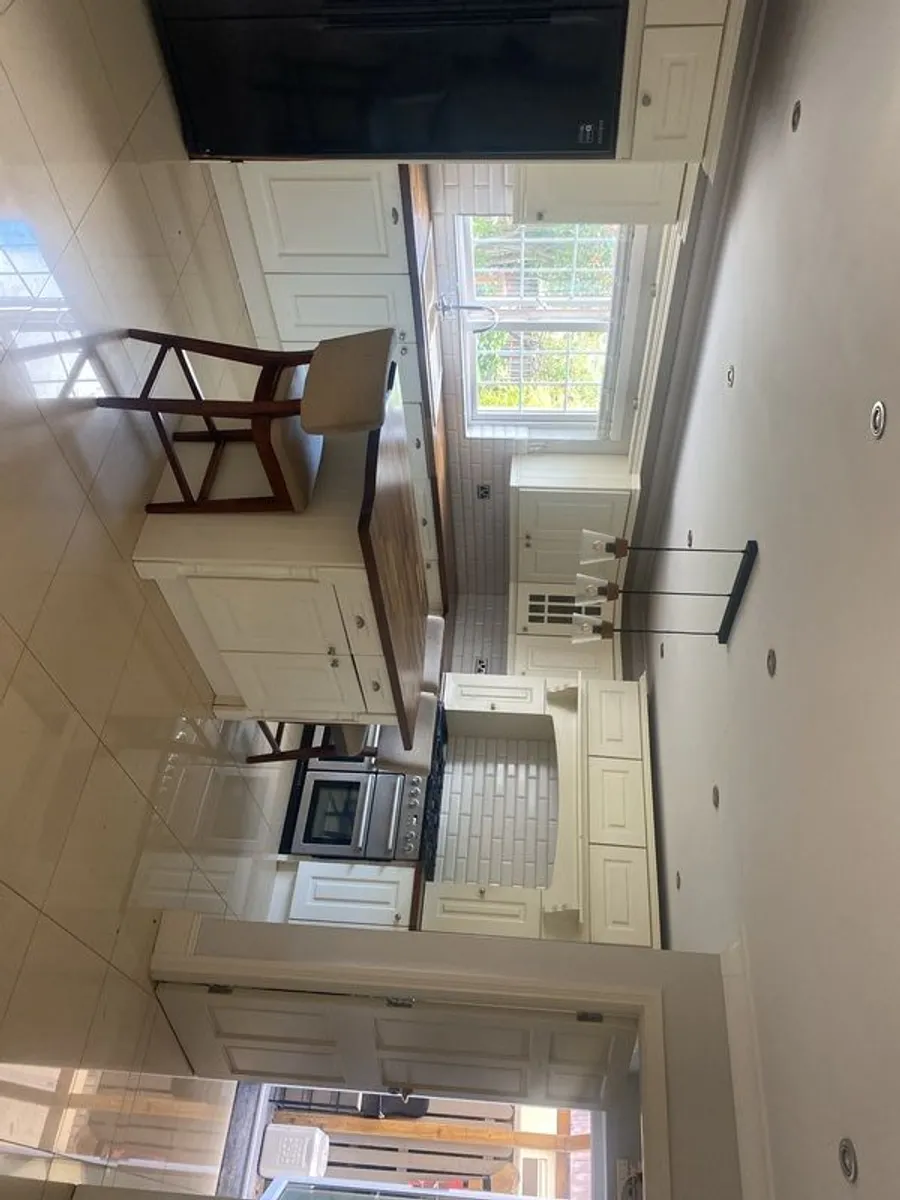Fitted kitchen with walnut worktop - Image 1