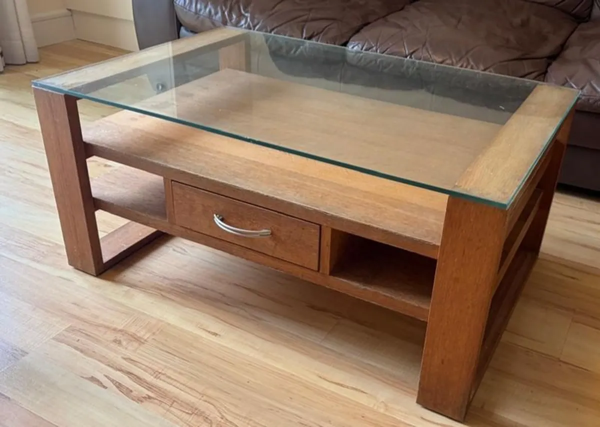 Coffee table - glass topped with shelves and 1 drawer (open to offers)