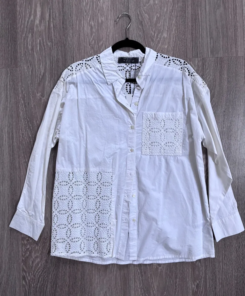New stylish white button-up blouse, a crisp cotton