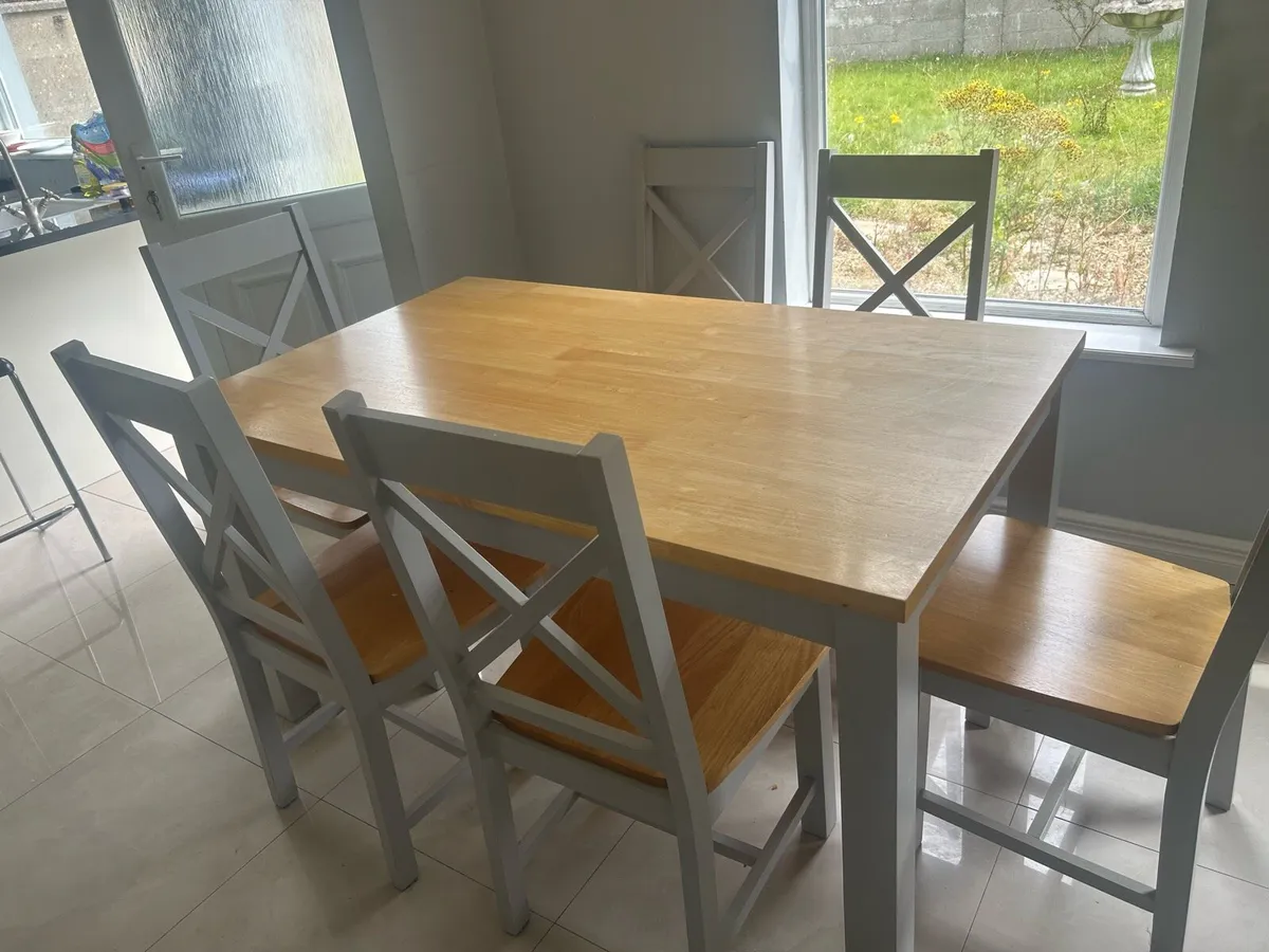 Grey and wooden dining table with six chairs - Image 1