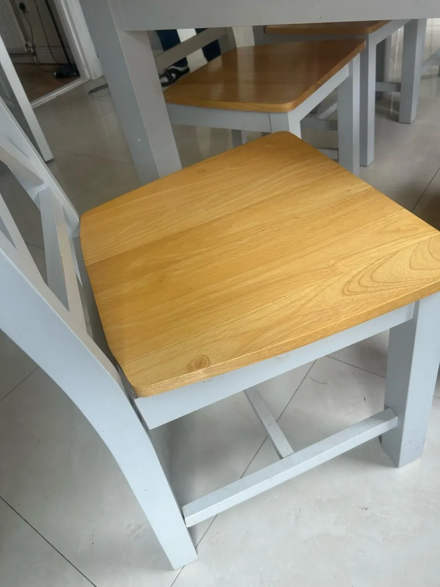 Grey and wooden dining table with six chairs - Image 2