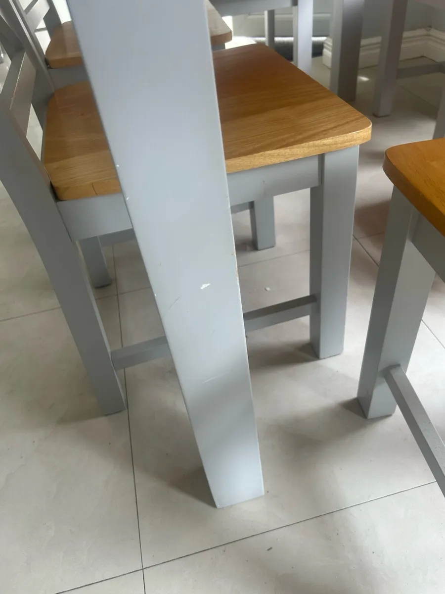 Grey and wooden dining table with six chairs - Image 3