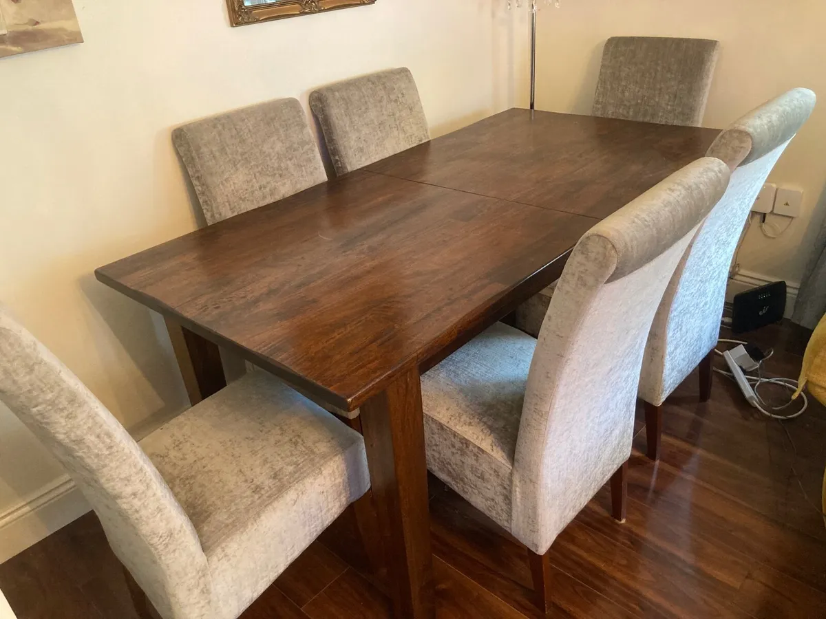 Rosewood dining table and six chairs - Image 1