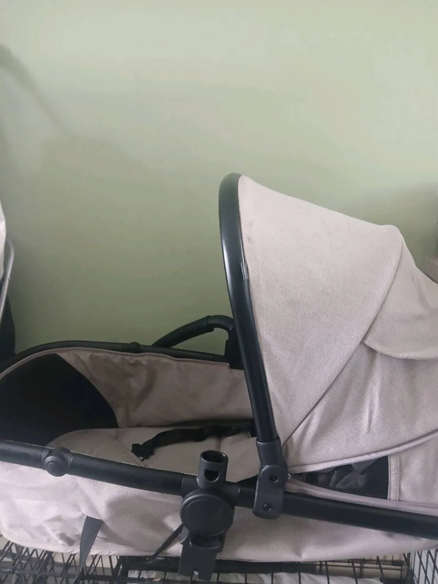 Selling next to new born pram cream basish colour