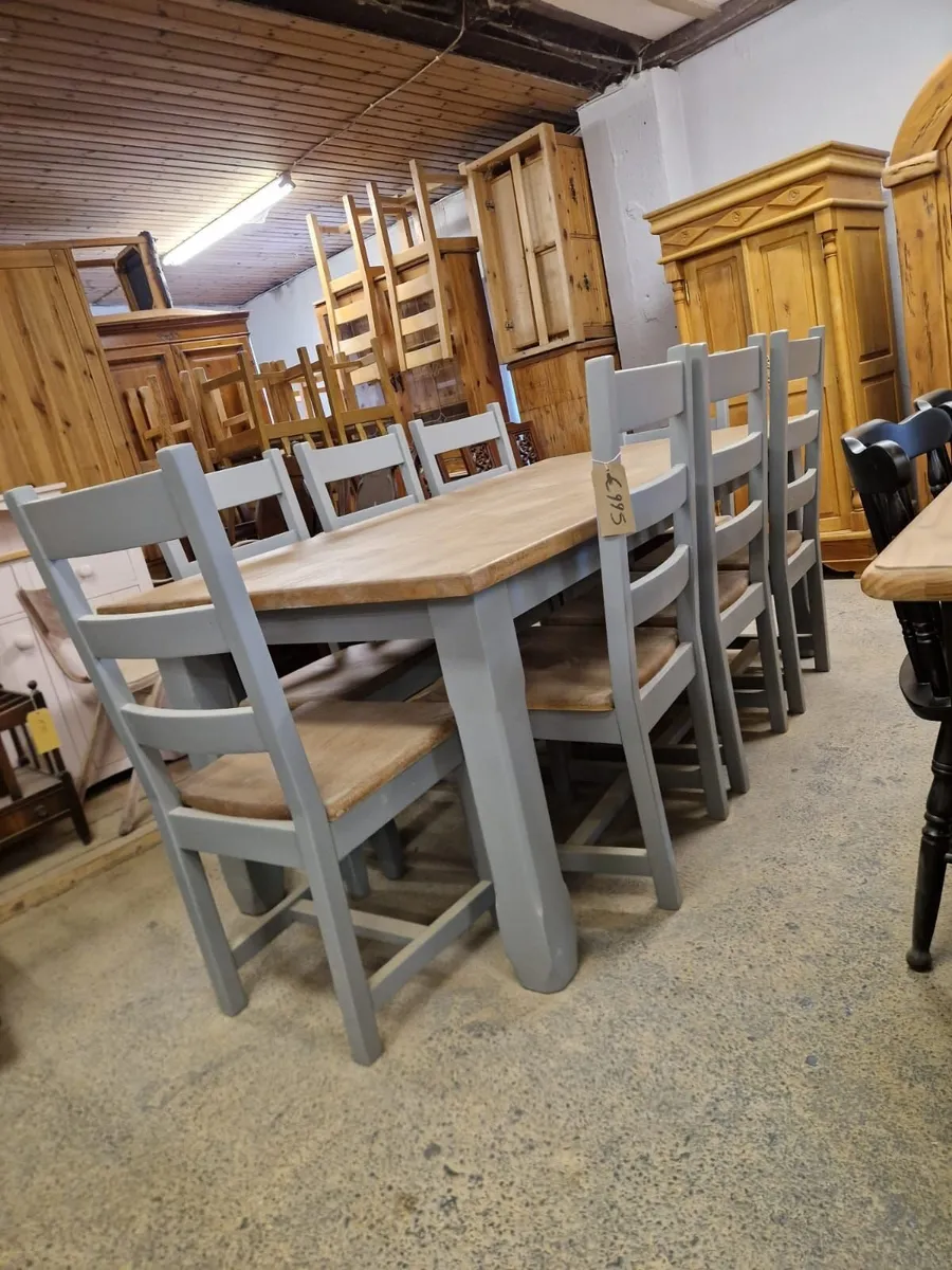 Solid oak table, 8 oak ladder back chairs - Image 1