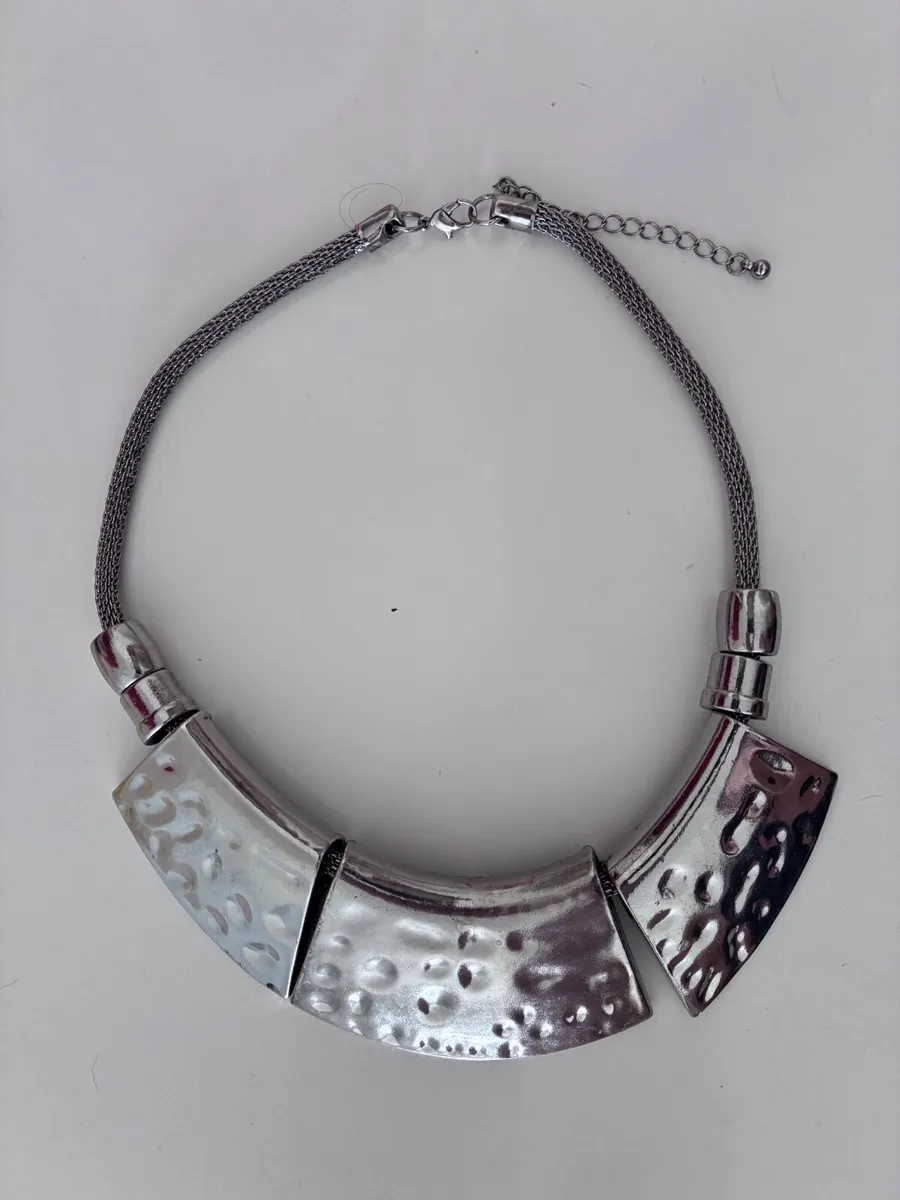 gunmetal-finished statement necklace features thre