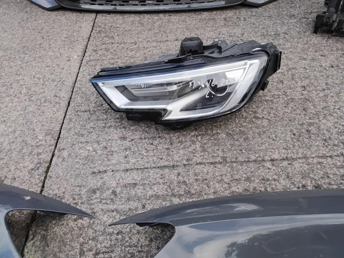 17 AUDI A3  LEFT HEADLIGHT AND RAD PACK - Image 1