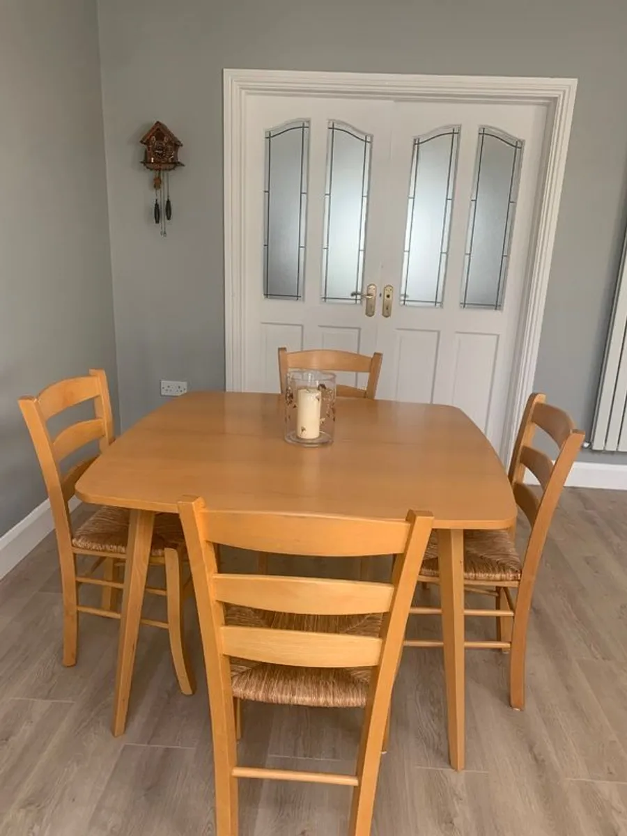 Extendable dining table and chairs - Image 1