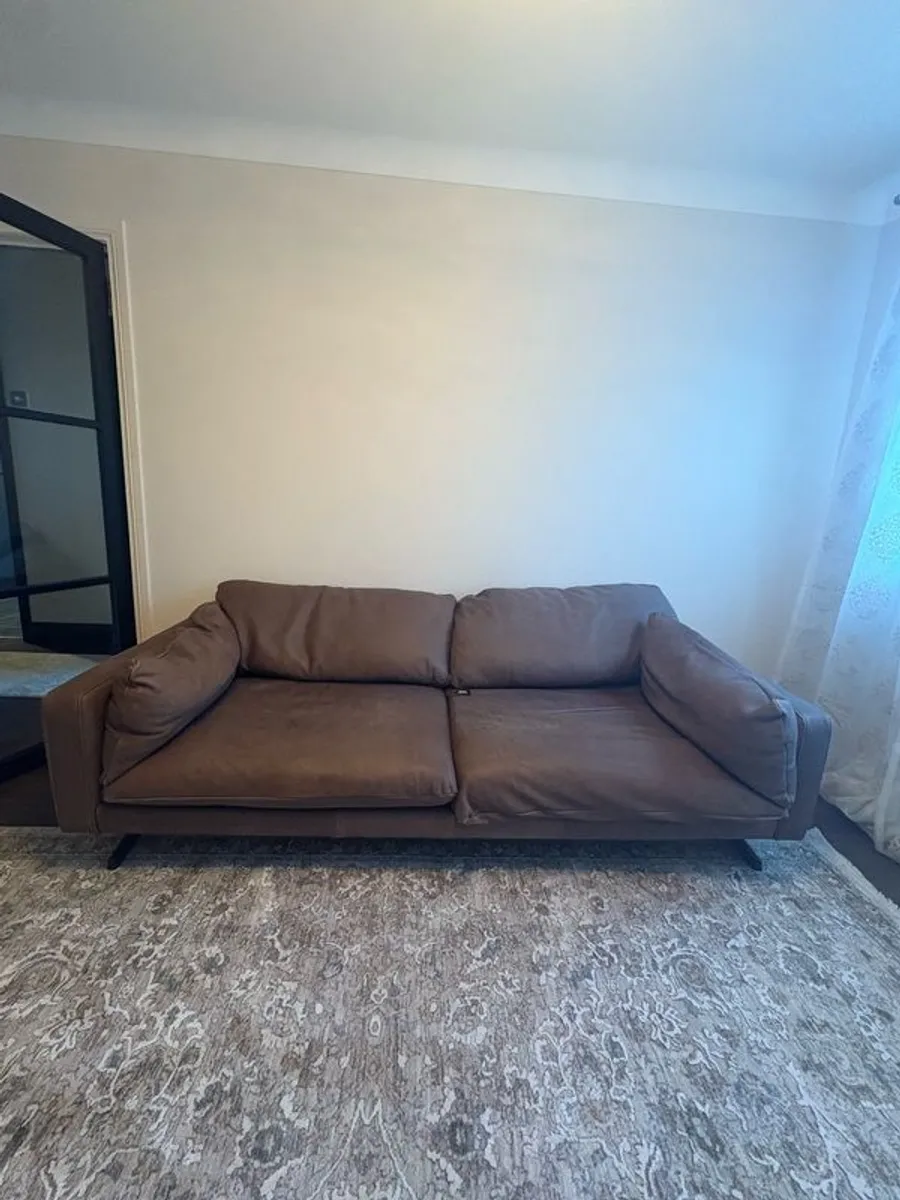 Leather sofa with original harvey Norman tag still attached - Image 1