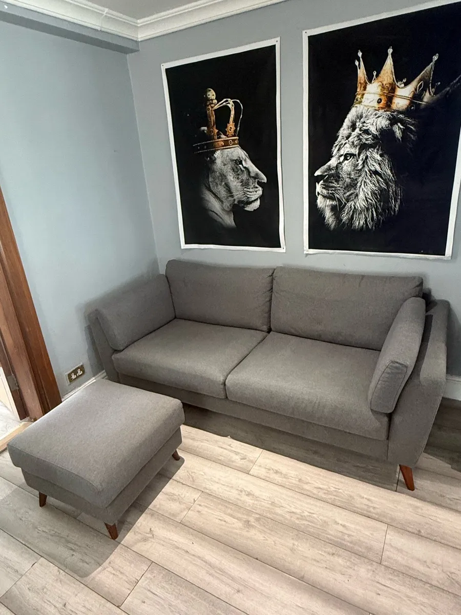 Grey 3-seater sofa with matching footstool - Image 1