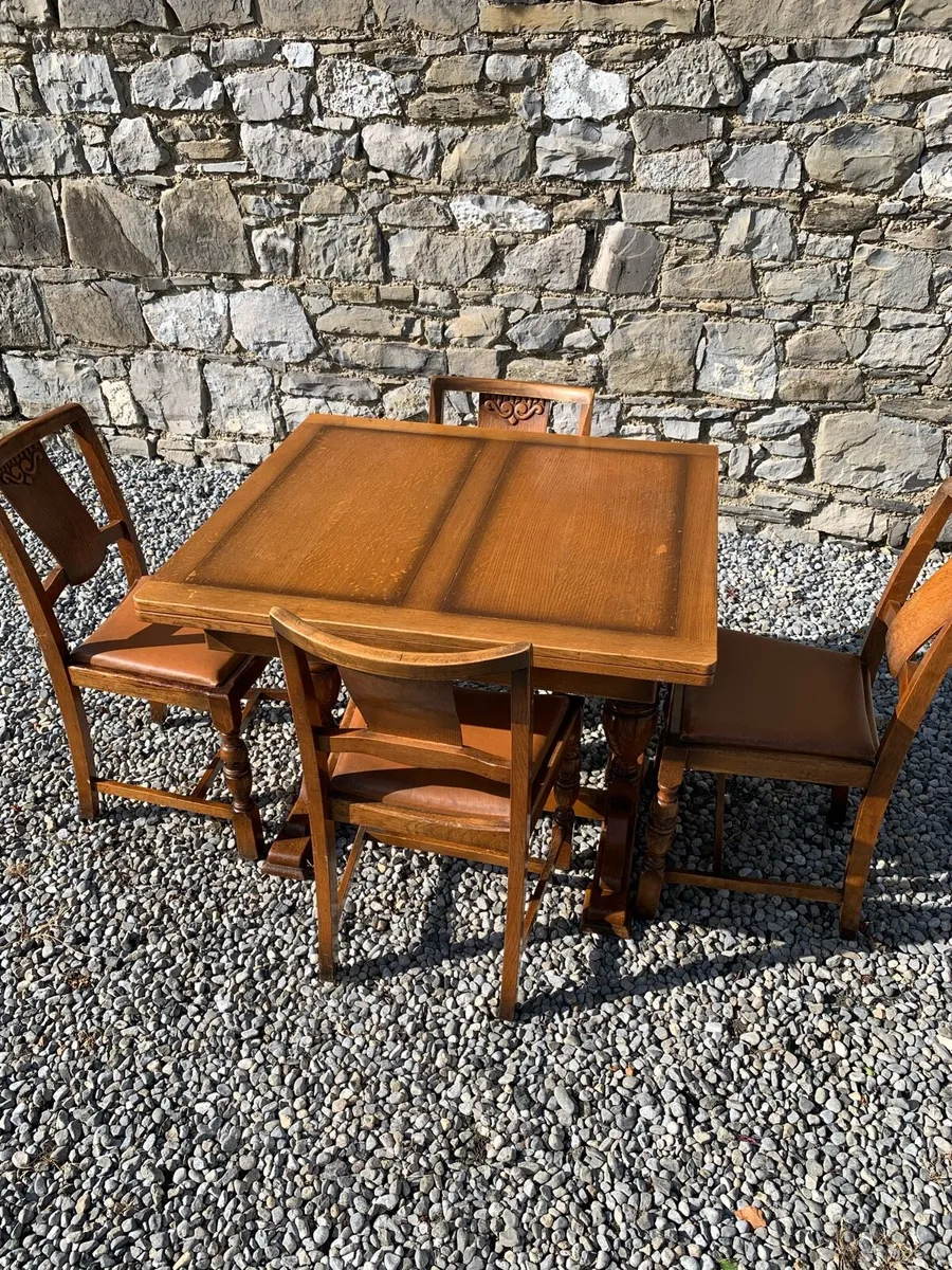 Solid oak extending dining table and 4 chairs. - Image 1