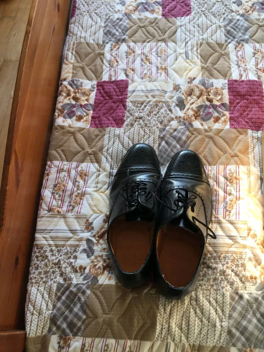 Black leather brogues