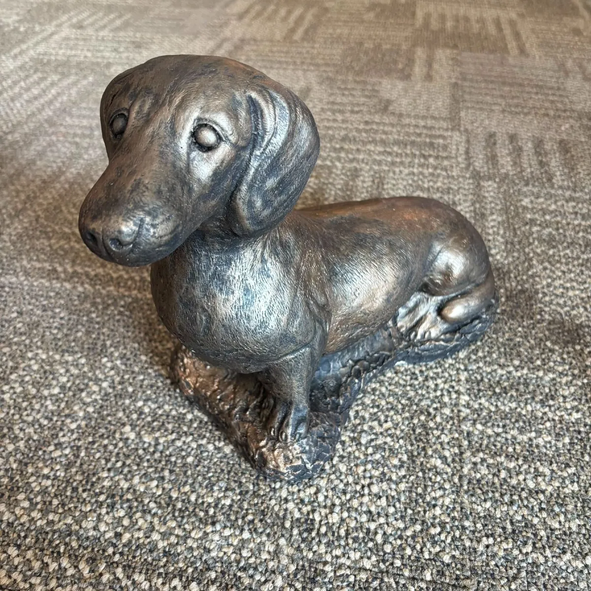 Stone, sausage dog, with a bronzed or antiqued met - Image 1