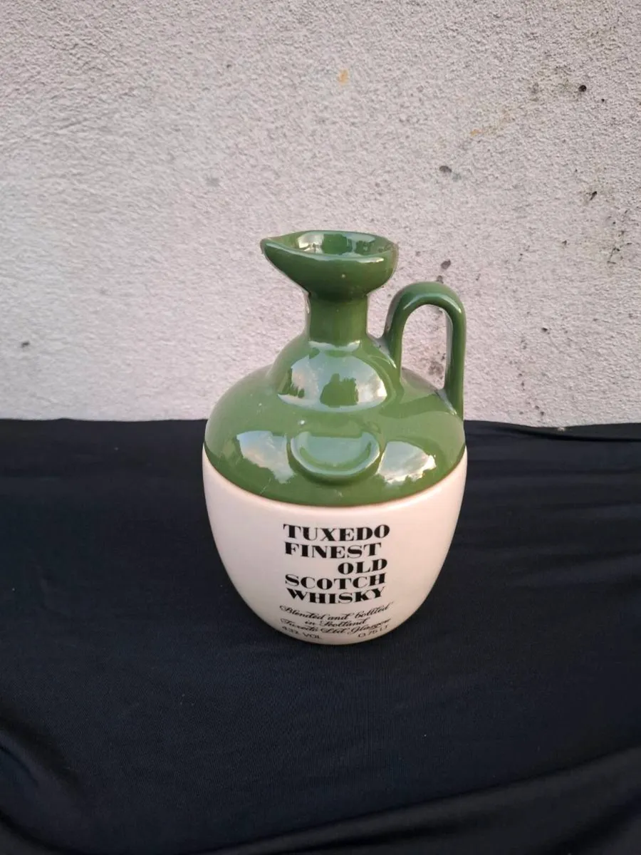 Tuxedo vintage whiskey bottle postage possible