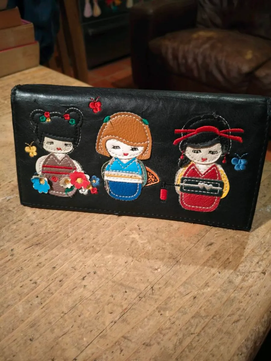 black faux leather wallet featuring three embroide - Image 1