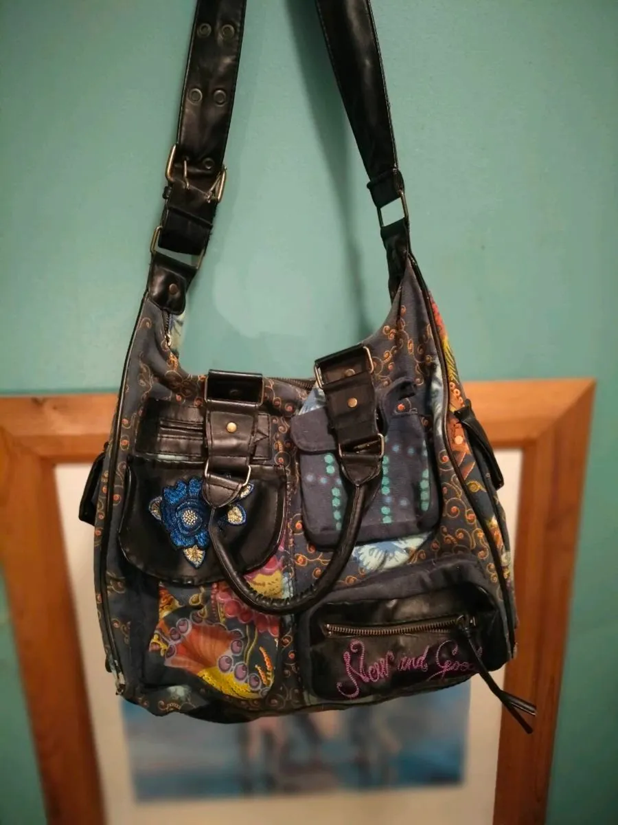 This colorful patchwork shoulder bag is from the b - Image 1
