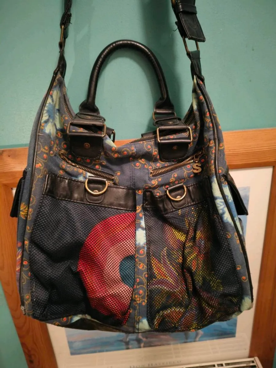 This colorful patchwork shoulder bag is from the b - Image 3