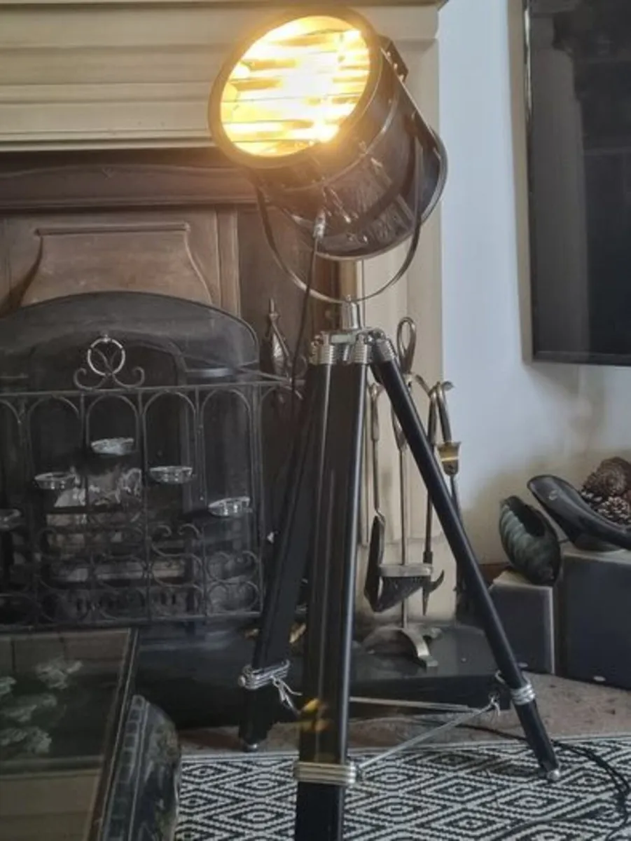 The Nautical is a large floor lamp with a tripod - Image 2
