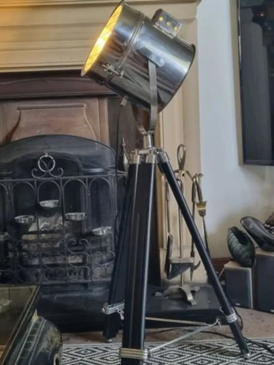 The Nautical is a large floor lamp with a tripod - Image 1