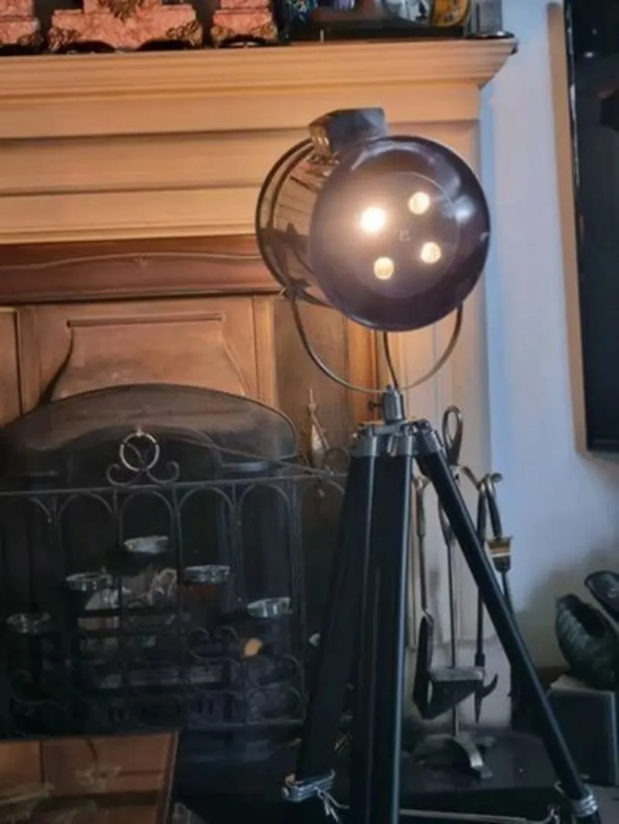 The Nautical is a large floor lamp with a tripod - Image 4