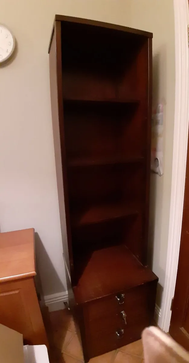 Tall mahogany shelving unit