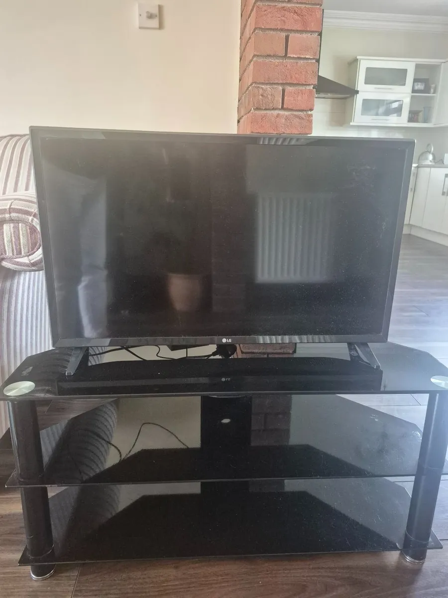 TV and TV stand. 32 inch smart TV - Image 1