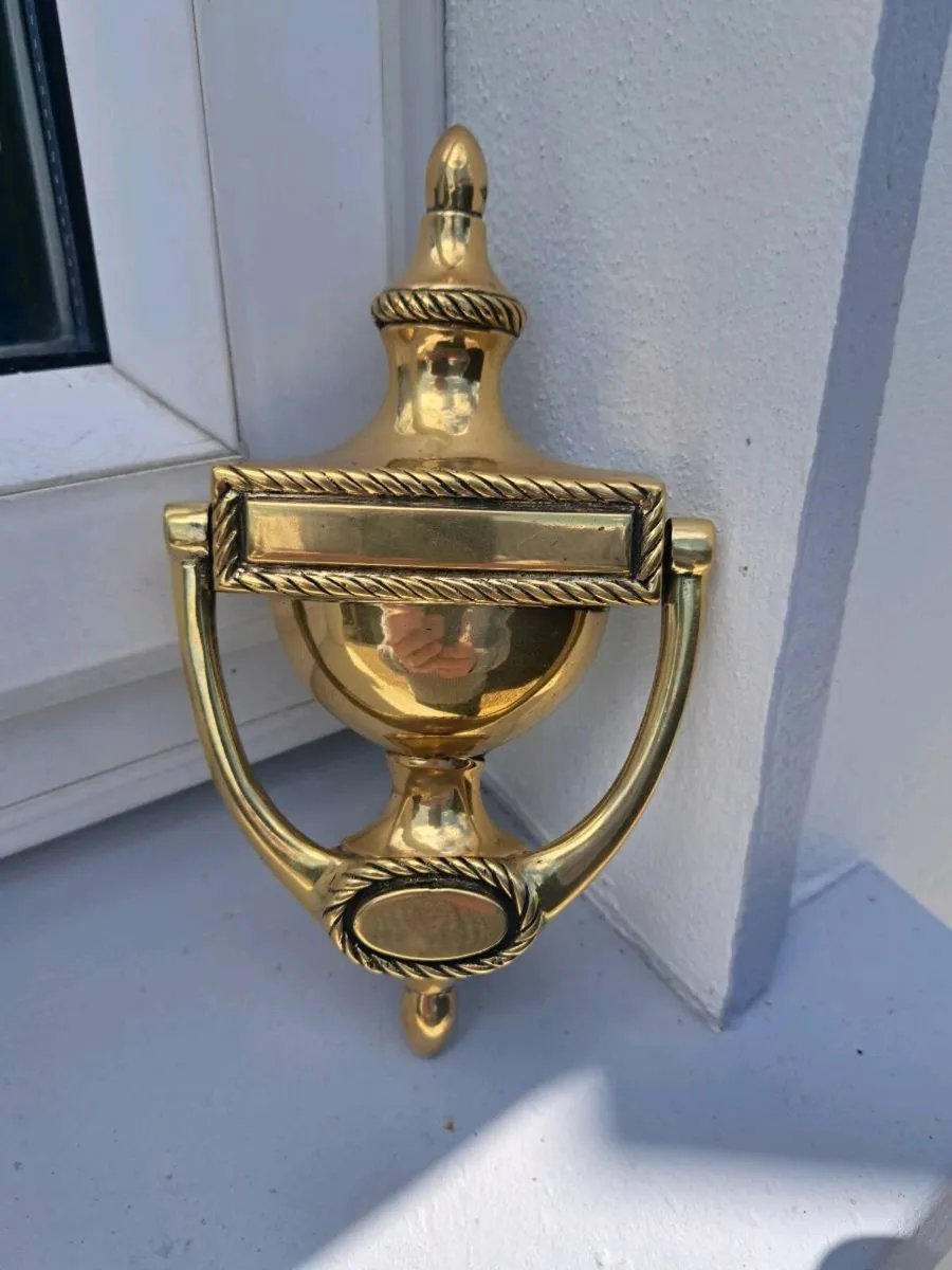 Old brass door striker - Image 1