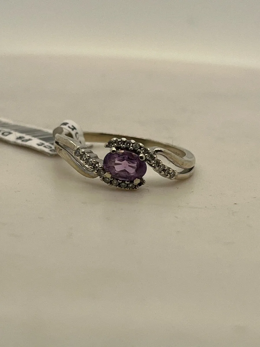 9k white gold ring with purple stone and diamonds. - Image 1