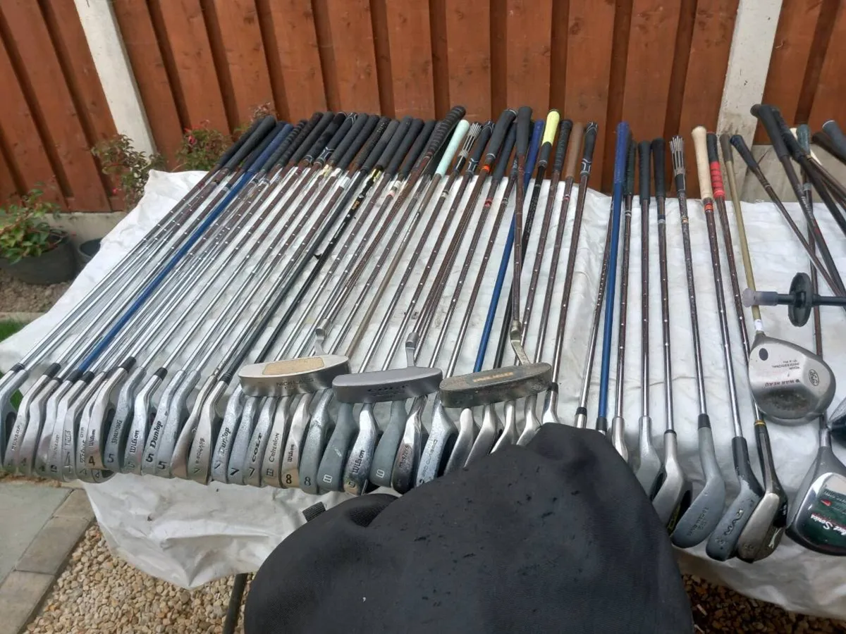 A selection of golf clubs and bags. - Image 2