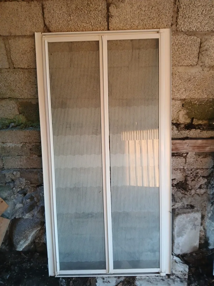 Bi- fold  shower door.  Like new. - Image 1