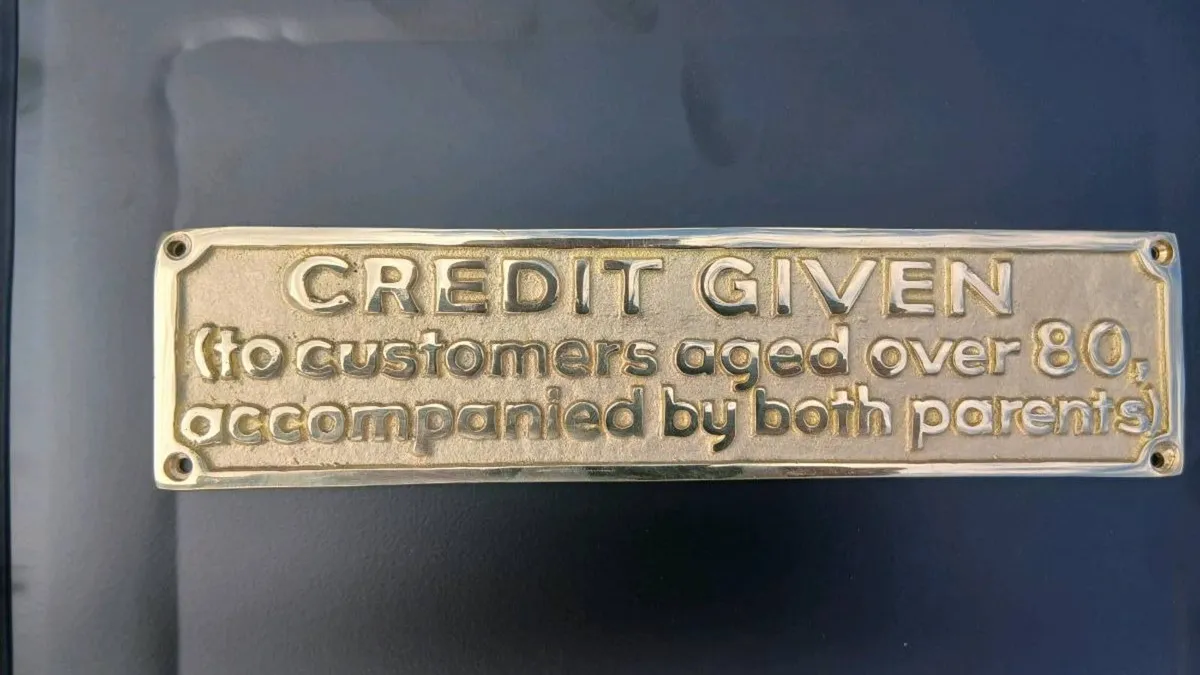 Humorous Brass Credit Sign