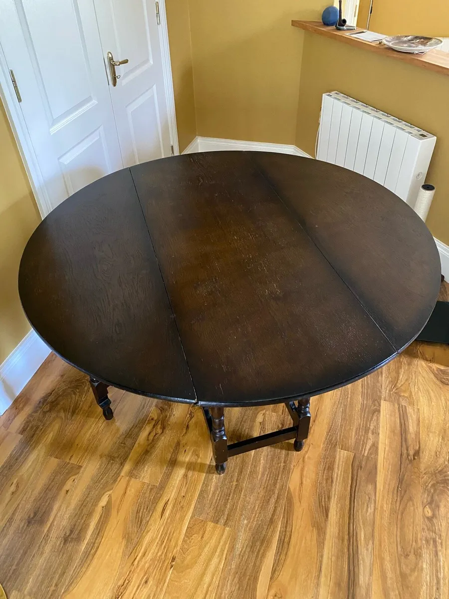 Folding Round Dining Table in Solid Dark Oak - Image 1