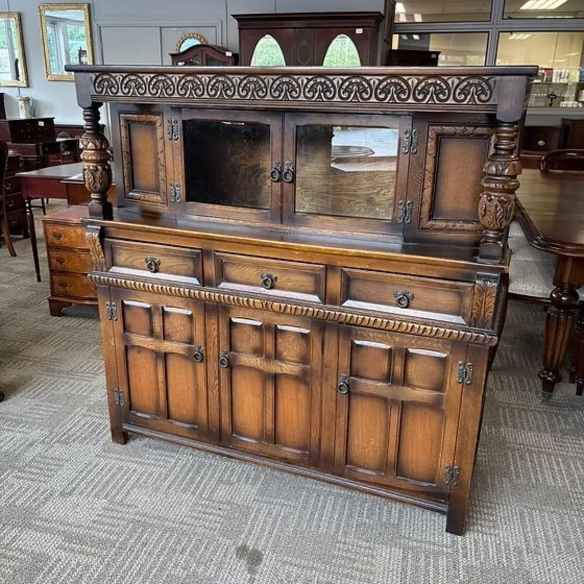 Old Charm leaded-glass court Jacobean oak dresser.