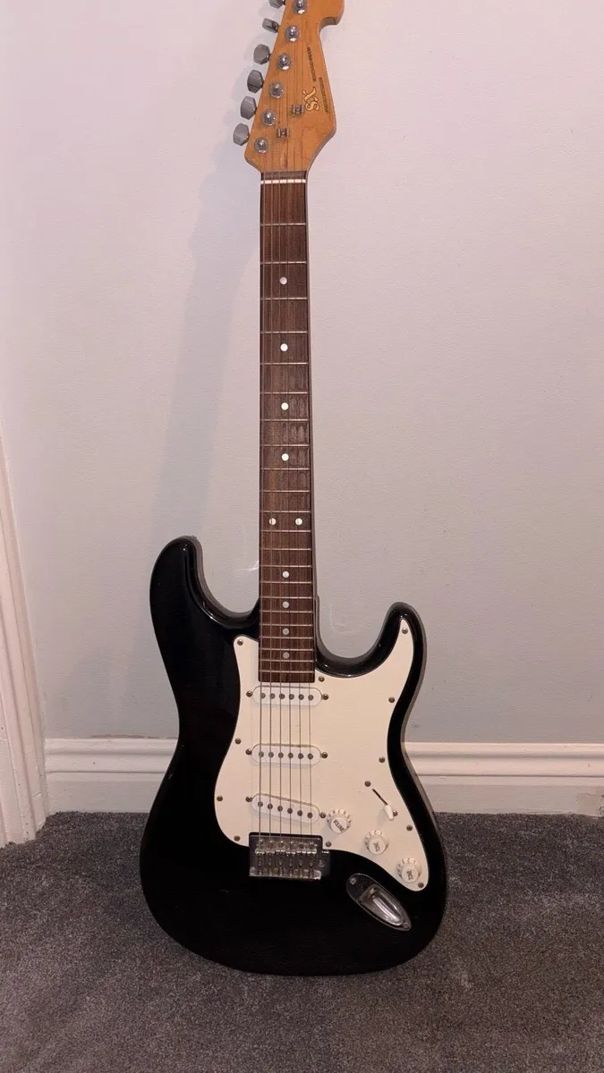 SX Standard Series electric guitar. - Image 1