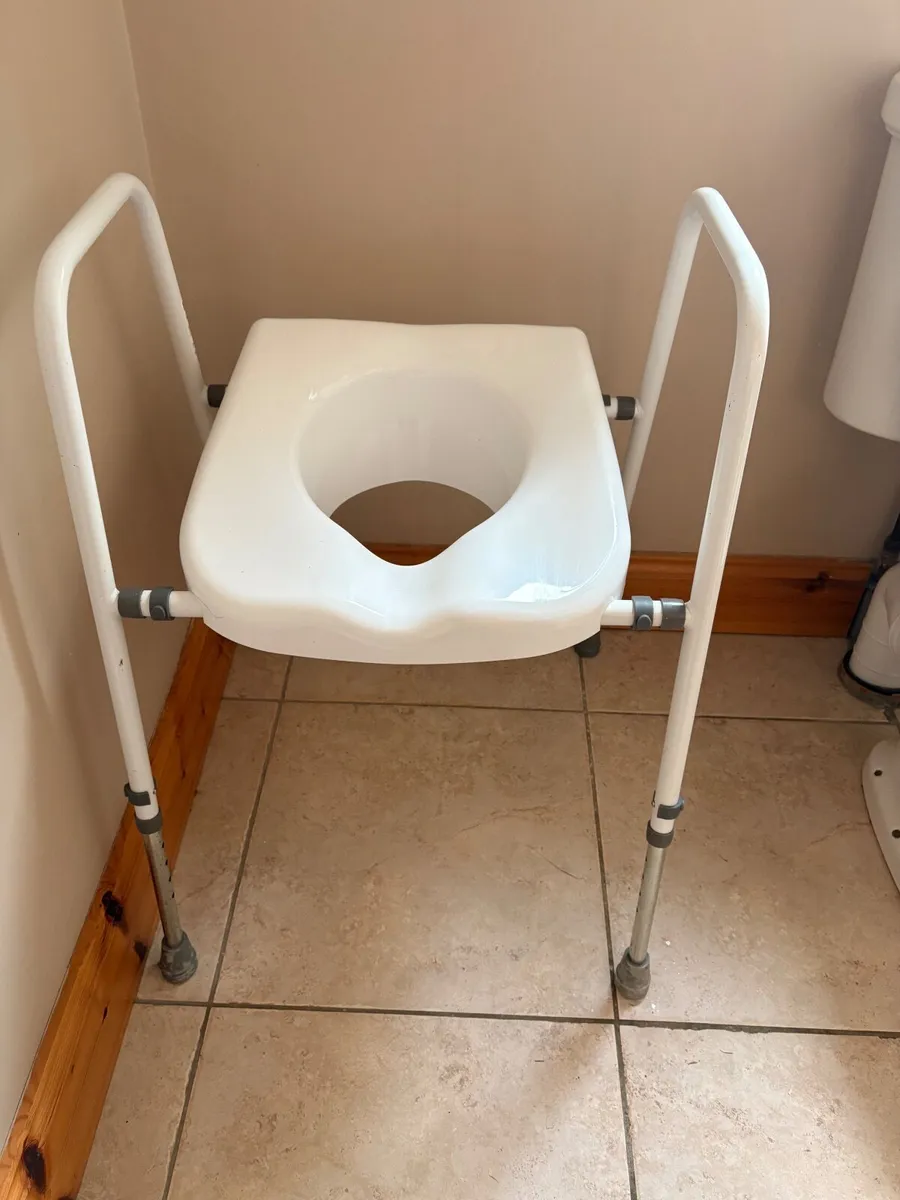 Raised toilet seat and frame