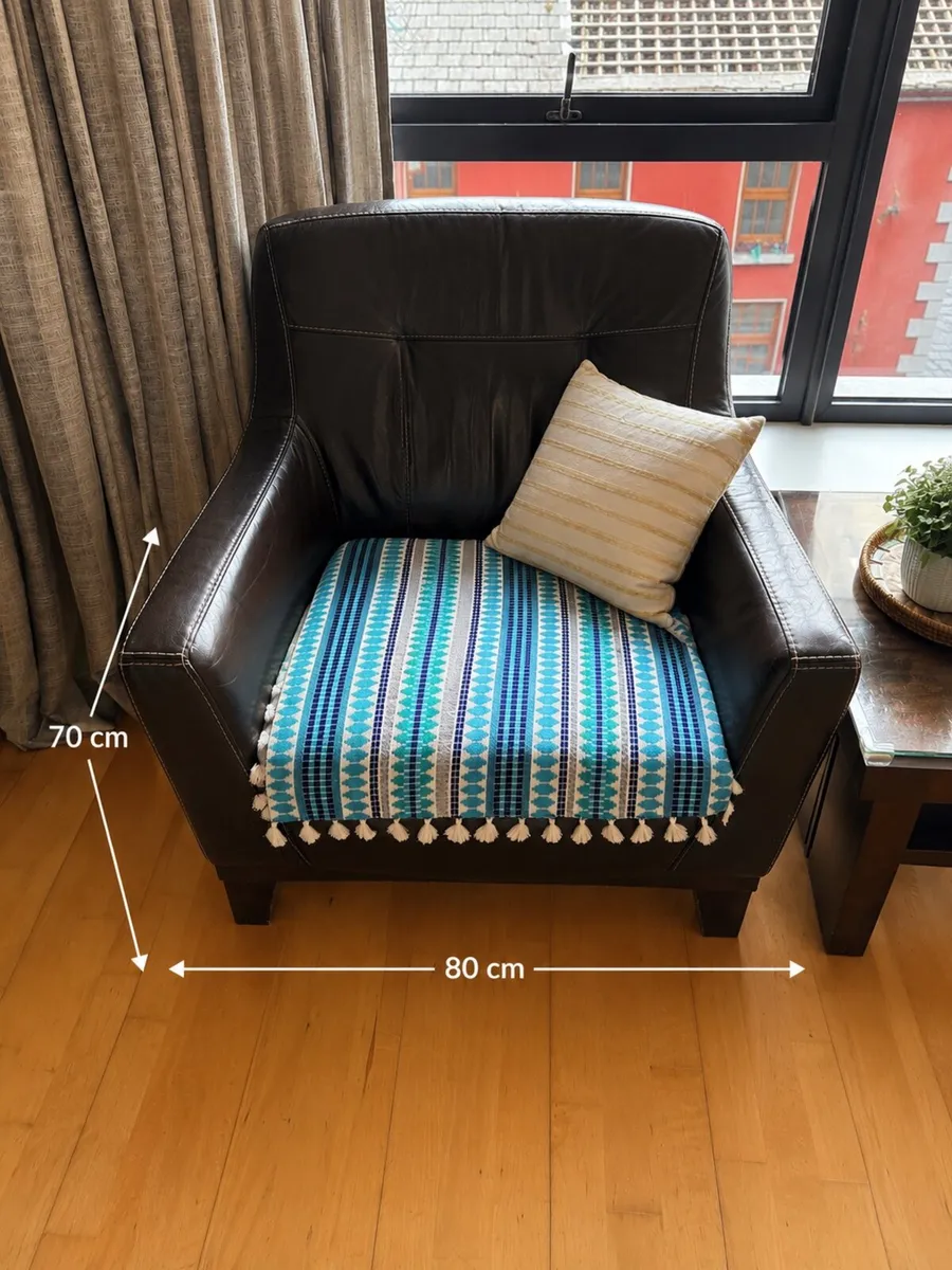 Dark brown leather arm chair