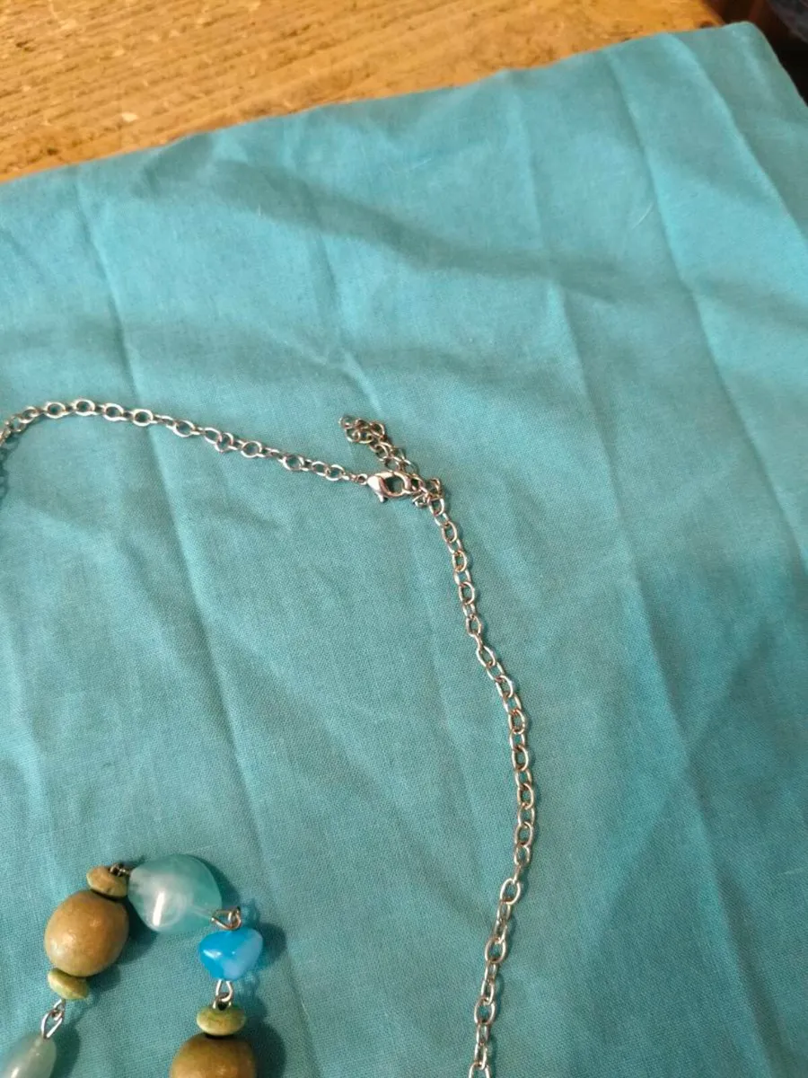 long, colorful beaded necklace featuring a mix of - Image 4