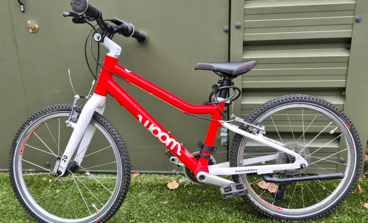 Woom 20” Kids Bike + Helmet - Image 1