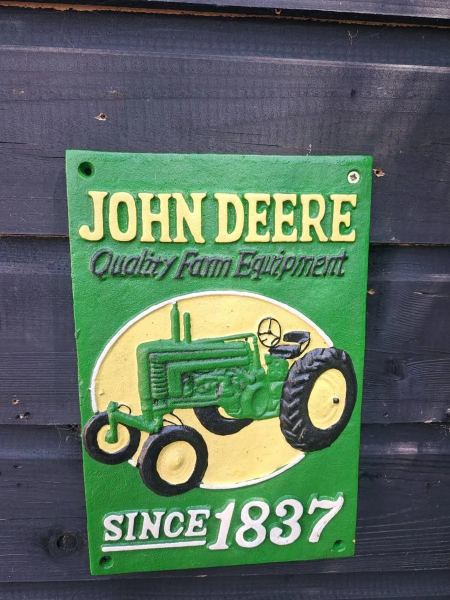 John deer cast iron sign