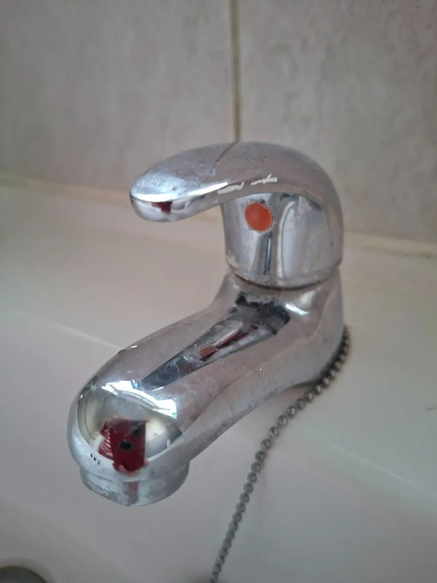 Bathroom  sink and double bed - Image 2