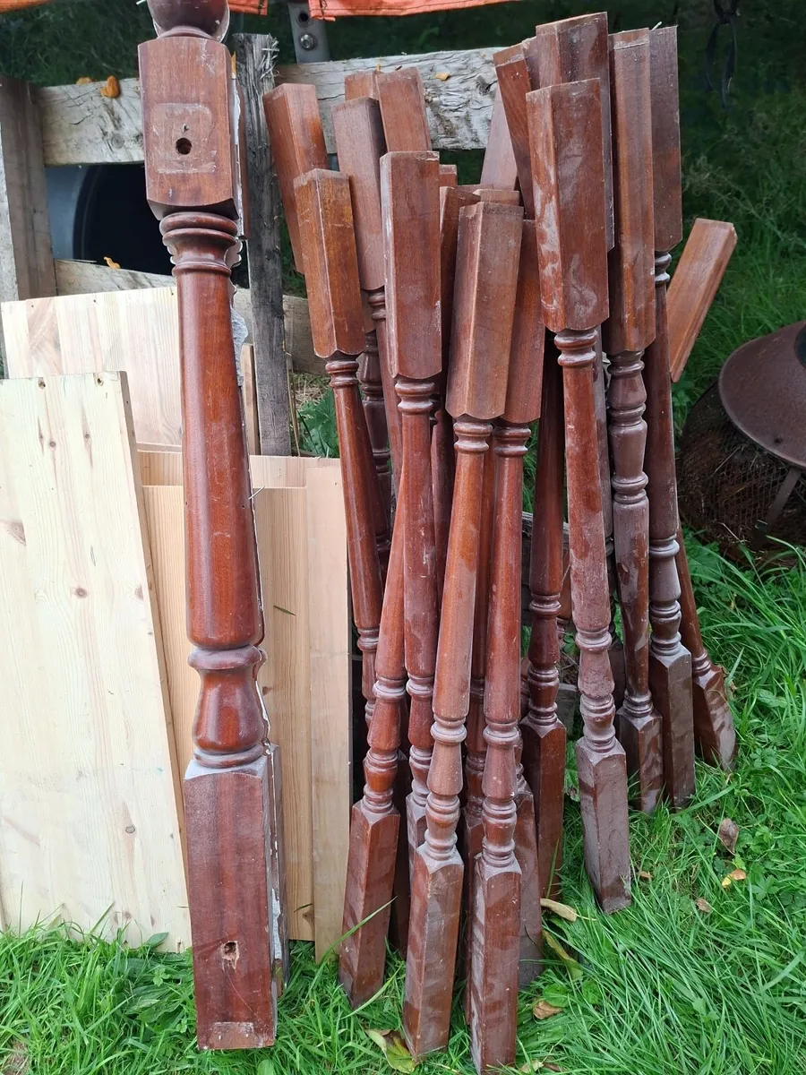 Hard wood mahogney stairs post and spindles - Image 1
