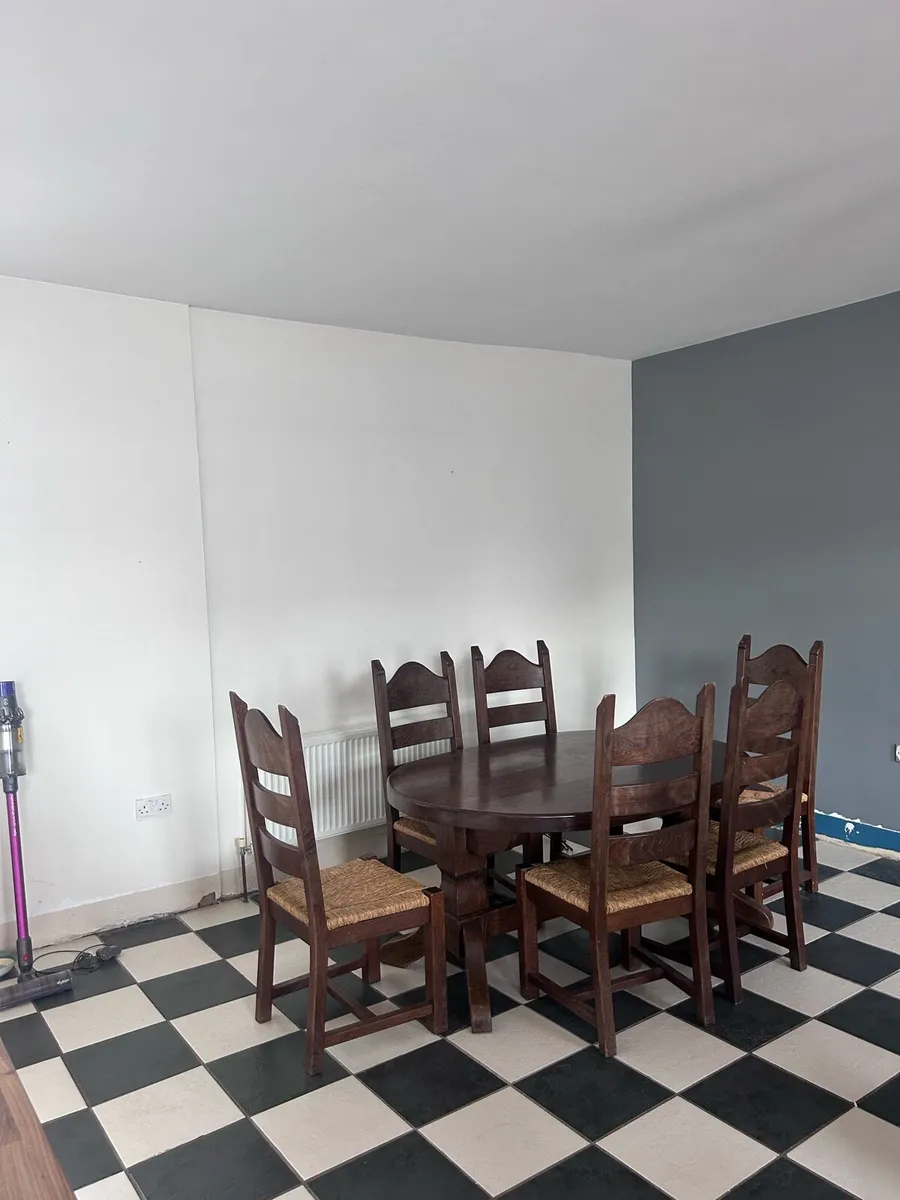 Oval solid wood dining table & 6 woven rush chairs - Image 2