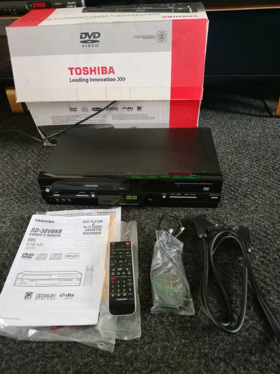 TOSHIBA VCR/DVD/CD PLAYER/RECORDER + Tapes - Image 1