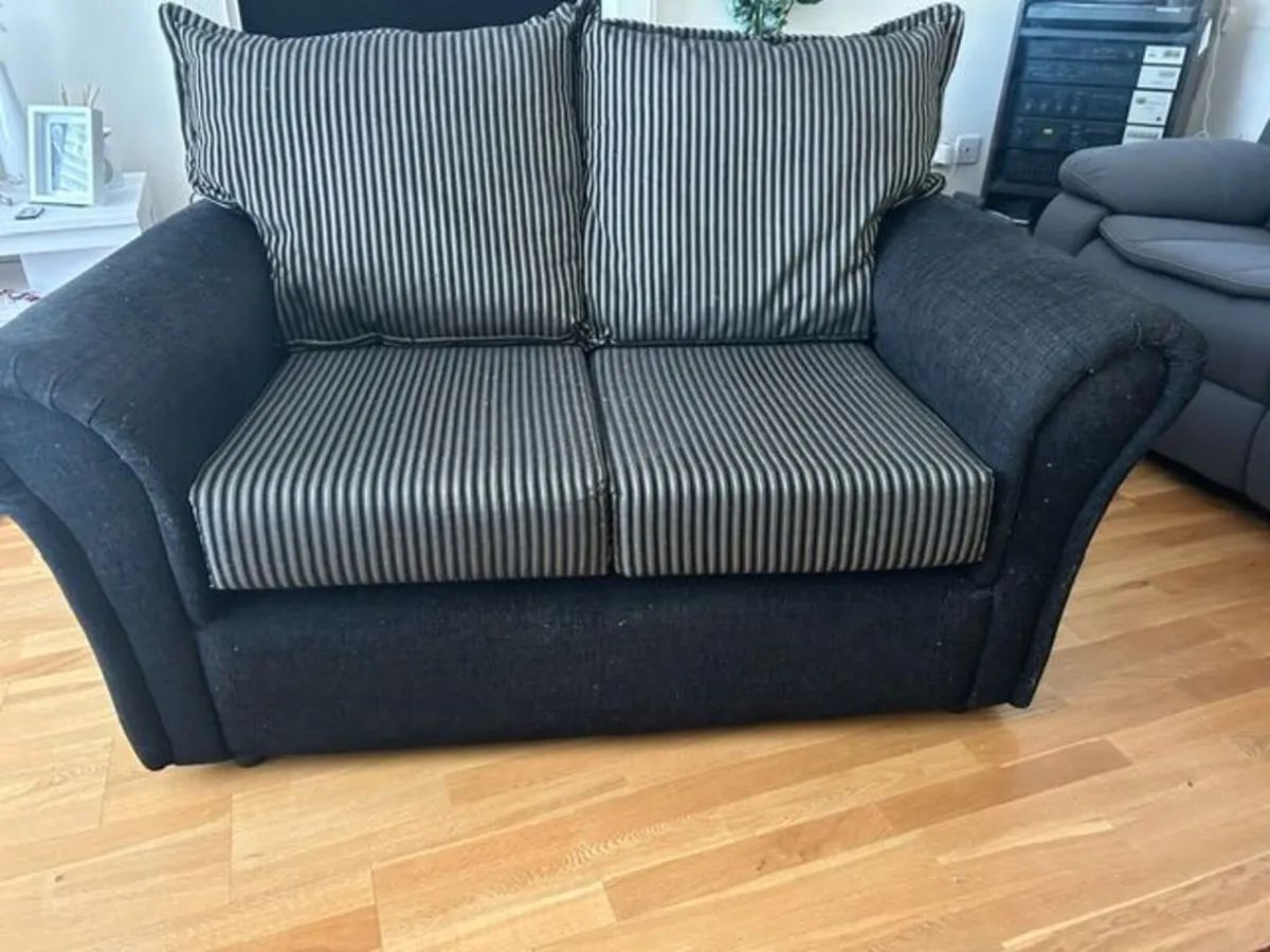 black  Sofa with gold stripe cushions